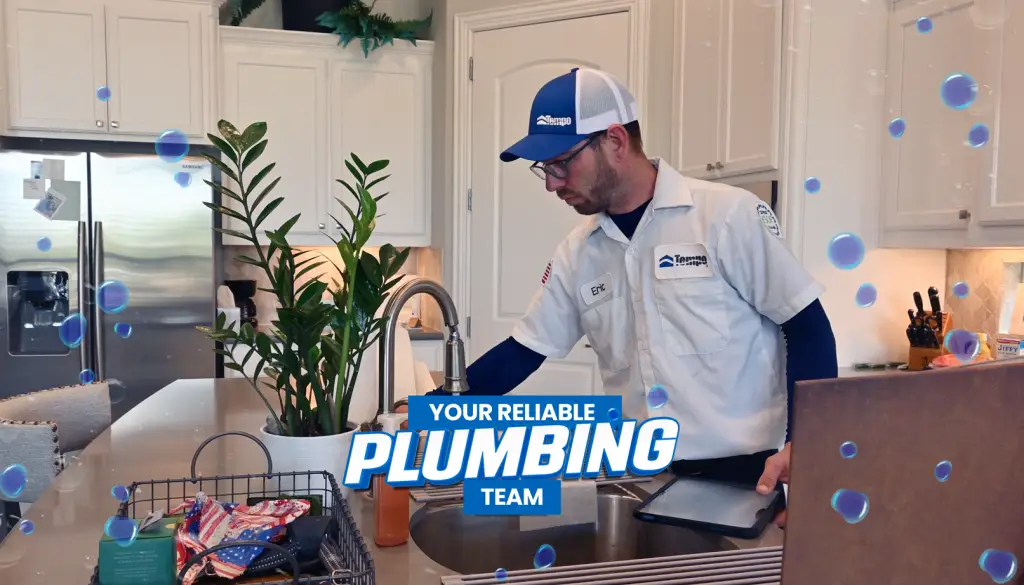 alt text="Carousel image showing a Tempo Air plumbing technician working in a residential kitchen with the headline “Your Reliable Plumbing Team.”"