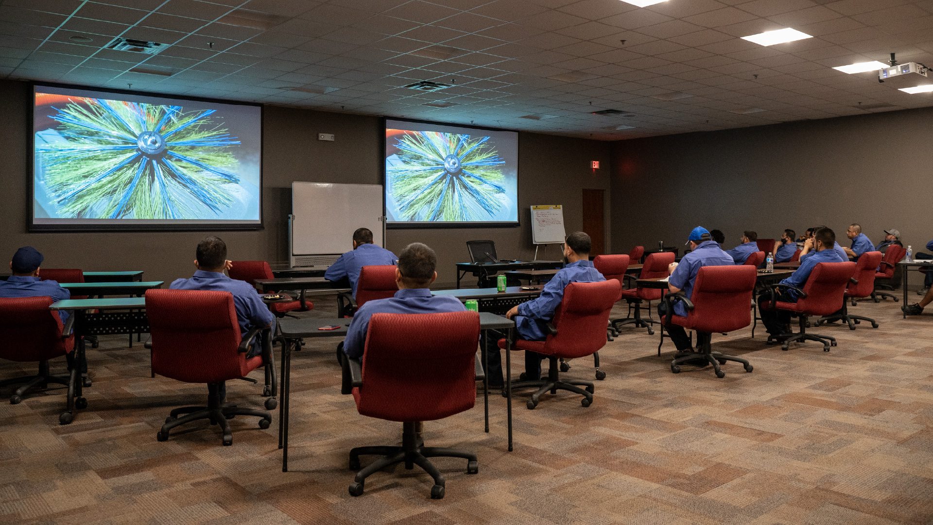alt="Tempo Air HVAC Technician receiving a training in a training room."