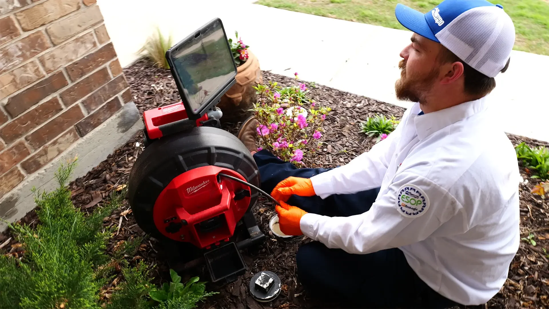 alt="Expert Tempo Air plumber in a drain camera inspection"